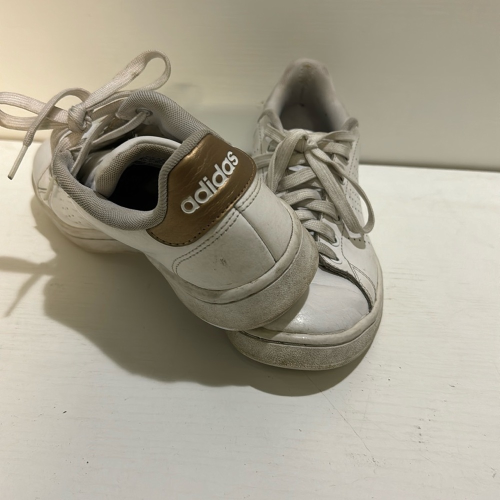 Adidas size 6.5 women’s basic shoe with gold